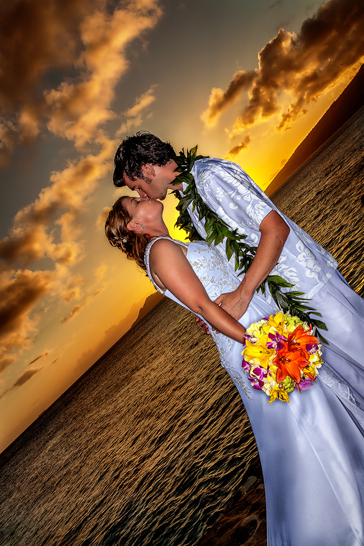 over looking the sunset at china walls on Oahu with jennifer